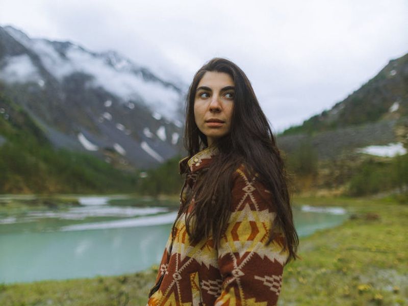 Person standing on a mountain looking at the horizon