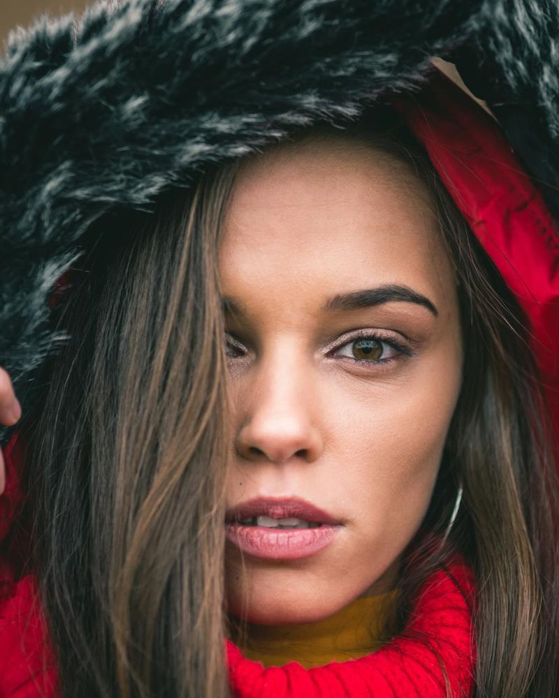 Young woman looking into distance with calm and clear eyes